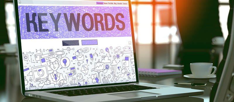 Keywords - Closeup Landing Page in Doodle Design Style on Laptop Screen. On Background of Comfortable Working Place in Modern Office. Toned, Blurred Image. 3D Render_ Keywords - Closeup Landing Page in Doodle Design Style on Laptop Screen. On Background of Comfortable Working Place in Modern Office. Toned, Blurred Image. 3D Render_